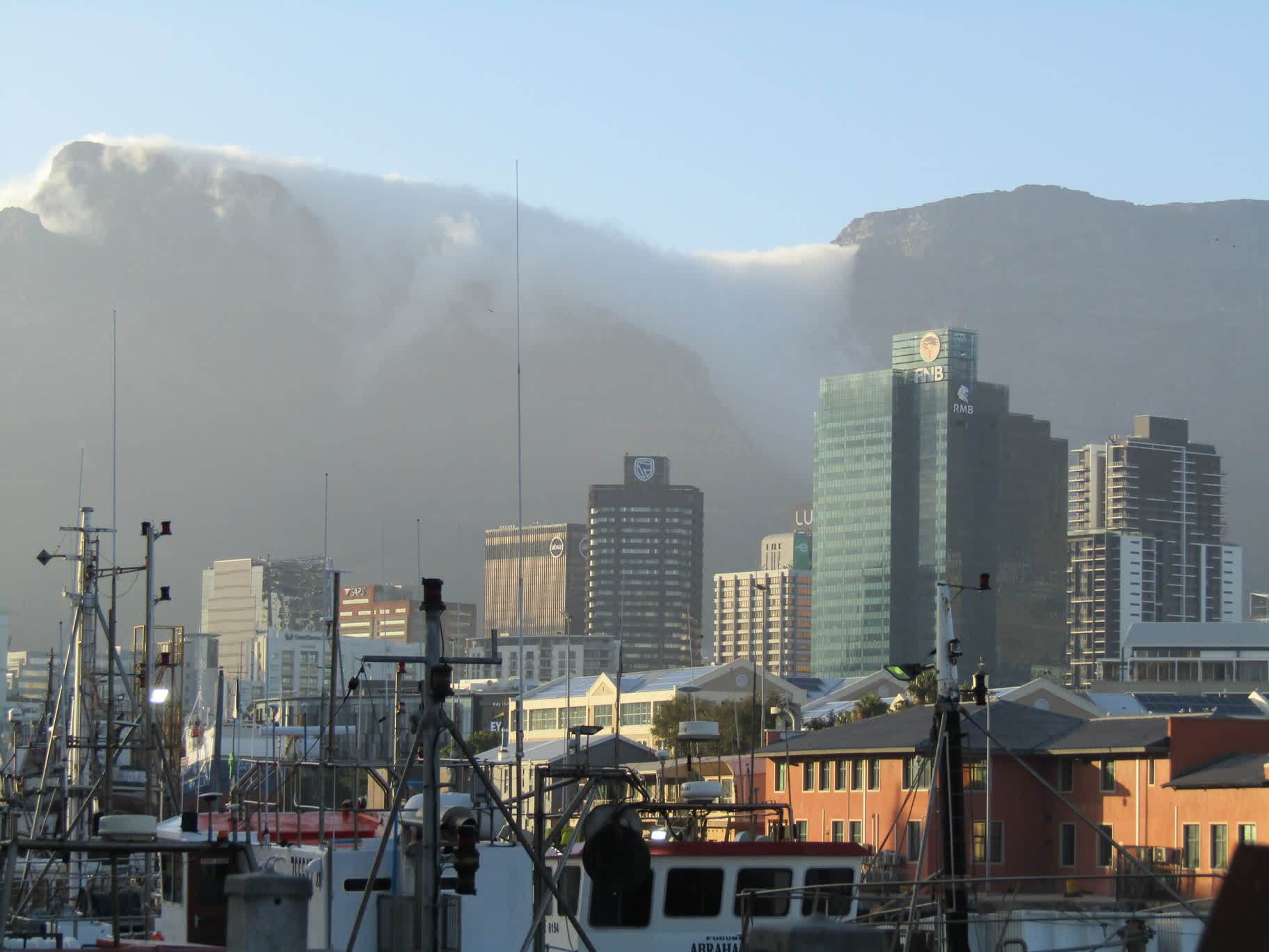 Looking south toward the financial district, with the fog coming over Table Mountain