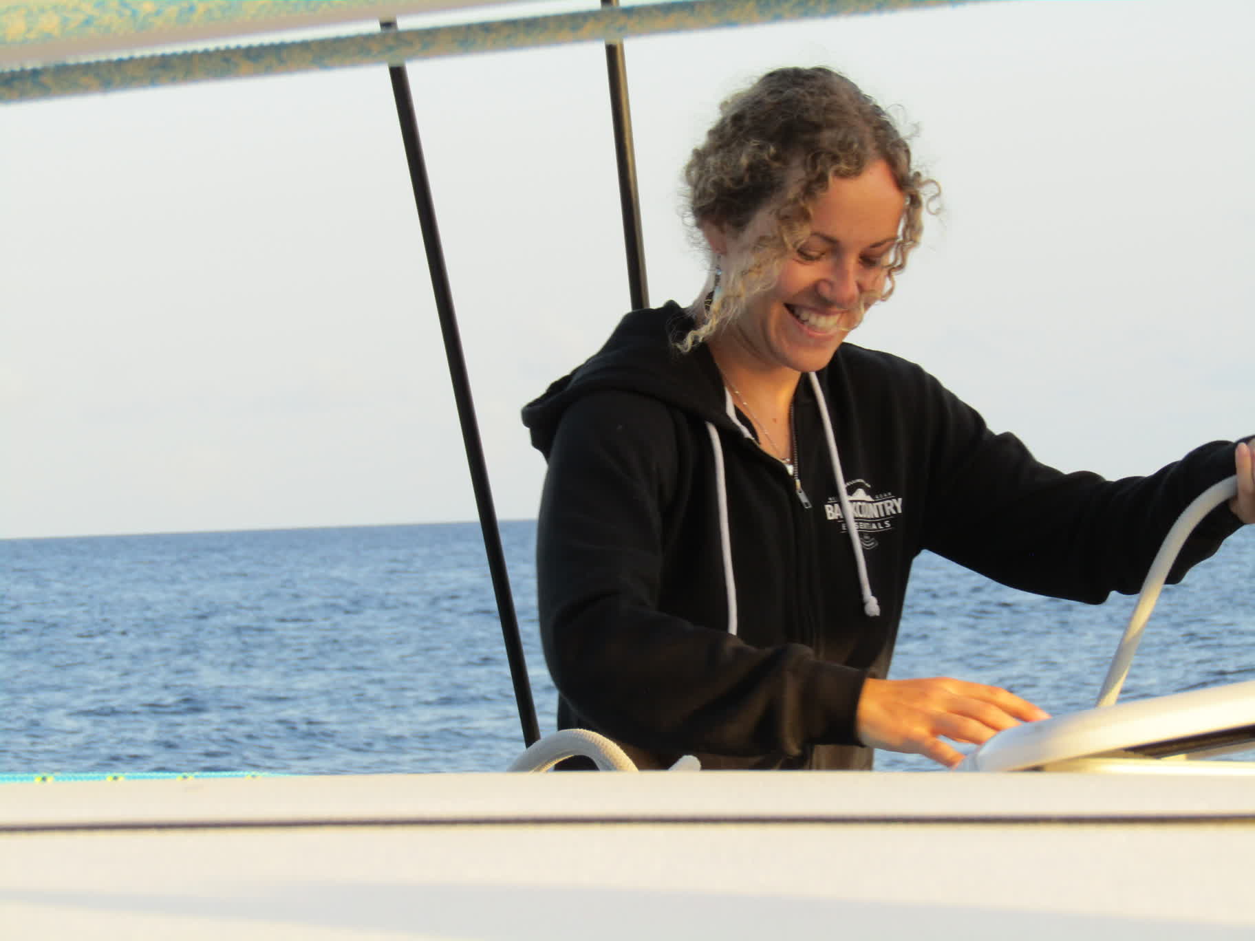 Brianna cheerfully tidying up the boat