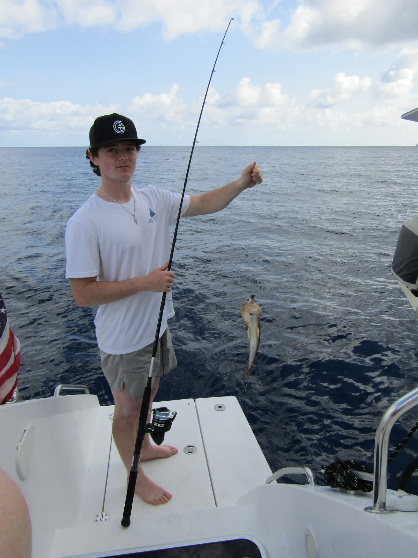 Auden with a fish he caught while we waited to go ashore