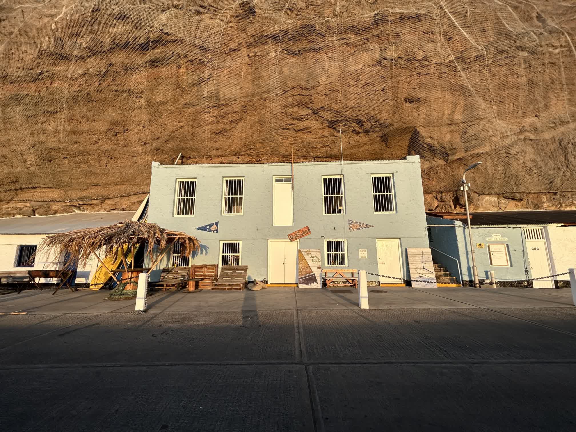 The St. Helena Yacht Club built into the rock cliff along the wharf, complete with wood pallet patio furniture. Photo courtesy of Brianna