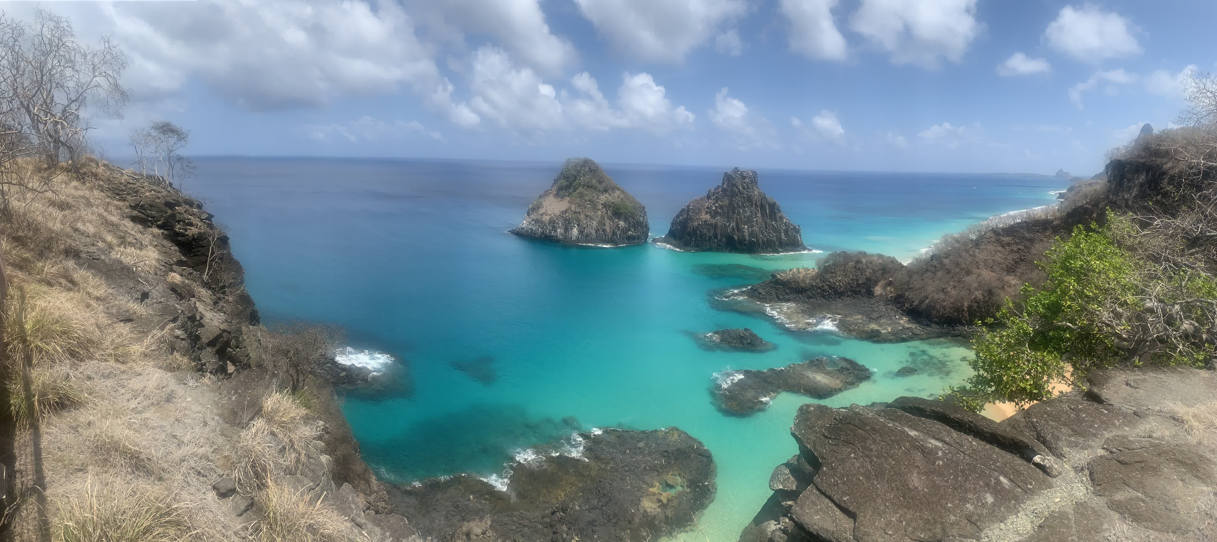 Panoramic view of Two Brothers Rock. The gauziness is due to the lens on my phone having sunblock on it. The beach we swam at was on the other side of the ridge on the right-hand side of the picture.