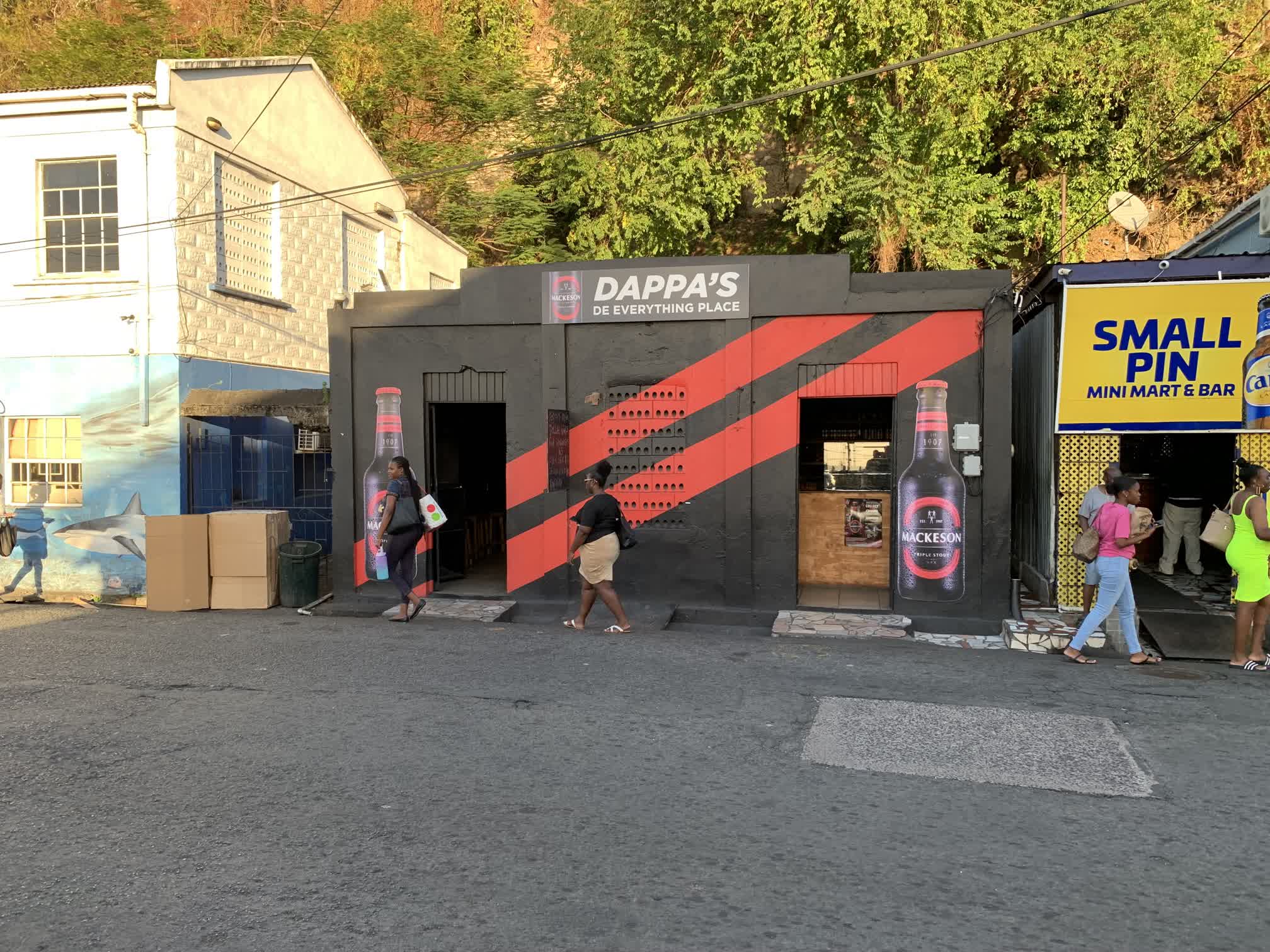 If it hadn't been for the sandwich board out front offering food, I doubt we would ever have set foot in this place. It is one block from the bus station in St. George's, across the street from the public fish market